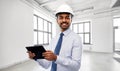 Architect or businessman in helmet with tablet pc Royalty Free Stock Photo