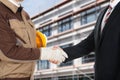 Architect and businessman shaking hands Royalty Free Stock Photo