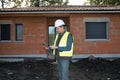 Architect cheking house under construction Royalty Free Stock Photo