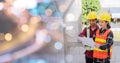 Architect and client discussing the plan with blueprint of the building at construction site Royalty Free Stock Photo