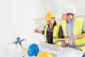 Architect and construction engineer indoor meeting. Royalty Free Stock Photo