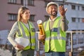 Architect, construction site and employees with success, conversation and planning for new project. Engineer, man and Royalty Free Stock Photo