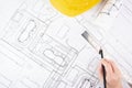 Architect design working drawing sketch plans blueprints and making architectural construction model in architect office Royalty Free Stock Photo