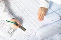 Architect designer working on architectural blueprints, building plans in the office, drawing Royalty Free Stock Photo