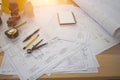 Architect desk ,Business,engineering concept,construction site, soft focus, vintage tone, working with blueprints in the office. Royalty Free Stock Photo