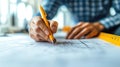 Architect drafting blueprints, office background