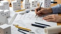 Architect drafting building plans with paper models architecture blueprint Royalty Free Stock Photo