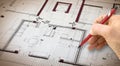 Architect drawing a planimetry of a residential building Royalty Free Stock Photo