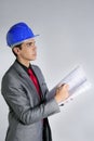 Architect engineer with blue hardhat Royalty Free Stock Photo