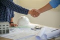 Architect and engineer construction workers shaking hands after successful collaboration Royalty Free Stock Photo