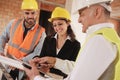 Architect Engineer And Manual Worker Meeting In Construction Site Royalty Free Stock Photo