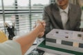 architect and engineer are shaking hand after successfully completing the work, an architect is consulting with an engineer about Royalty Free Stock Photo