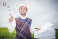 Architect engineer in white helmet and drawing thinks about good idea of project building house Royalty Free Stock Photo
