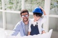 Architect father and his child girl working together at home,Laughing and funny,Happy loving family