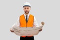 Architect in helmet holding construction plan. Royalty Free Stock Photo