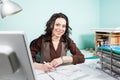 Architect at her working office with blueprints in front Royalty Free Stock Photo