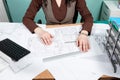 Architect at her working space with blueprints in front Royalty Free Stock Photo