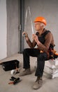 Architect holding tape measure. Civil engineer elderly senior man. Construction worker hold measuring tape. Retired builder worker Royalty Free Stock Photo