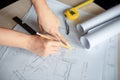 Male architect hand sketching on architectural drawing Royalty Free Stock Photo