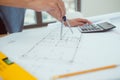 architect man working with laptop and blueprints,engineer inspection in workplace for architectural plan,sketching a construction Royalty Free Stock Photo