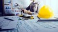 architect man working with laptop and blueprints,engineer inspection in workplace for architectural plan,sketching a construction Royalty Free Stock Photo