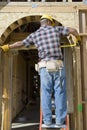 Architect Measuring Entrance Of House