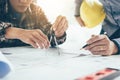 Architect people working on blueprint and analysis with partners Royalty Free Stock Photo