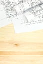 Architect's workspace with rolls and plans Royalty Free Stock Photo