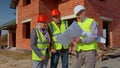 Architect with senior civil engineers discussing project work with blueprint of building house Royalty Free Stock Photo