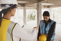 Architect site supervisor scolding female colleague working on construction site disciplinary punishment.