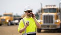 architect supervisor or construction engineer man talking on phone at building site Royalty Free Stock Photo