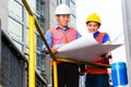 Architect and supervisor on construction site Royalty Free Stock Photo