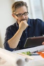 Architect Using Digital Tablet At Desk Royalty Free Stock Photo