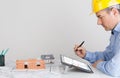 Architect using digital tablet on office table desk.