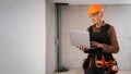 Architect using laptop computer on workspace. Civil engineer elderly senior man buying material online. Construction worker in Royalty Free Stock Photo