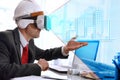 Architect visualizing 3d representation with virtual reality glasses in the office