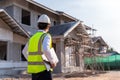 Architect watching some details on a construction, House builder concept