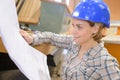 Architect woman with helmet and plans Royalty Free Stock Photo