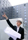 Architect woman working outdoor with buildings