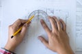 Architect working on blueprint, Engineer working with engineering tools for architectural project on workplace, Construction Royalty Free Stock Photo