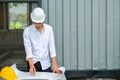 Architect working on blueprint.,engineer inspector in workplace Engineers in helmets planning new project Royalty Free Stock Photo