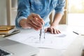 Architect working on blueprint, Engineer working with engineering tools for architectural project on workplace, Construction Royalty Free Stock Photo