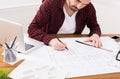 Architect working on blueprint in office Royalty Free Stock Photo