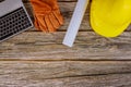 Construction office working computer keyboard with blueprints in the set of protective workwear in yellow hard hat protective Royalty Free Stock Photo