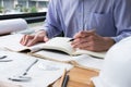 architect working on construction plan at office. engineer inspect blueprint at workplace. man sketching real estate project. Royalty Free Stock Photo