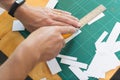 Close up of hands cutting paper Royalty Free Stock Photo