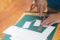 Close up of hands cutting paper Royalty Free Stock Photo