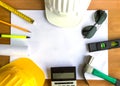 An architect working desk with tools and safety helmet with copy space Royalty Free Stock Photo