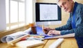 Architect working on drawing table in office Royalty Free Stock Photo