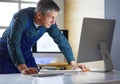 Architect working on drawing table in office Royalty Free Stock Photo